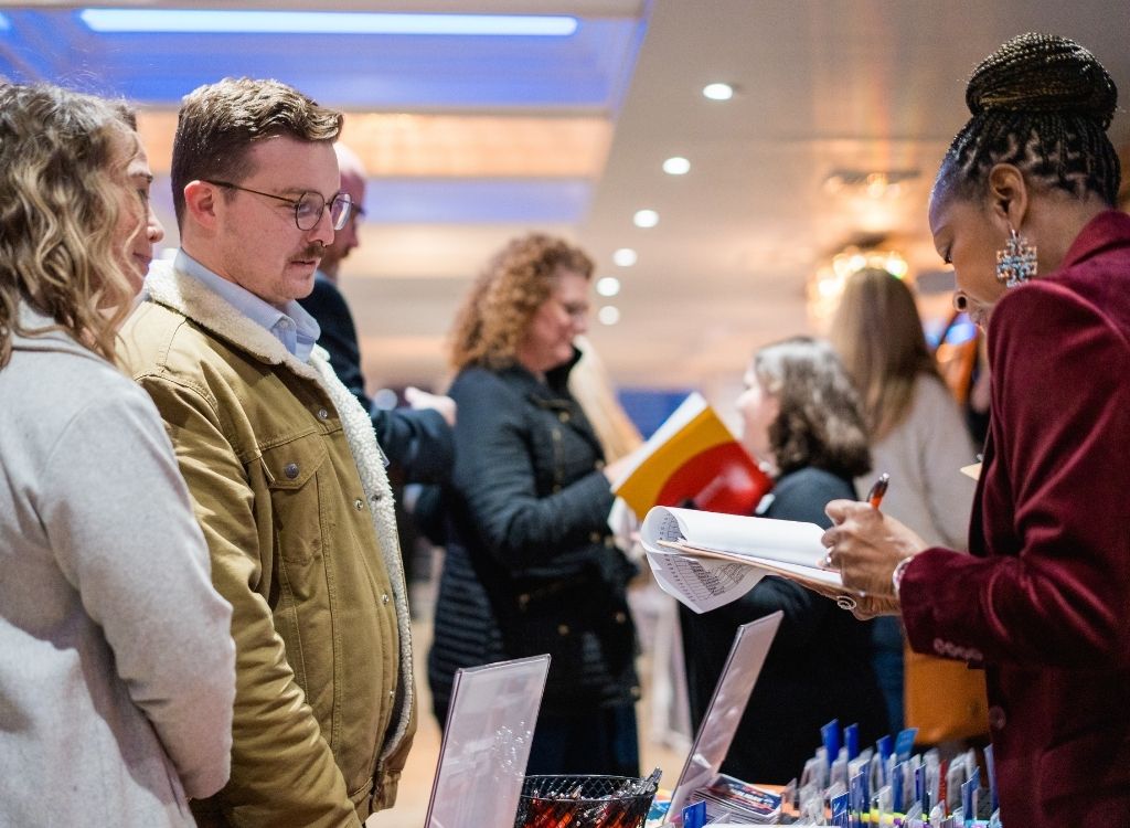 Guests gathered for a cocktail reception during a corporate yacht event